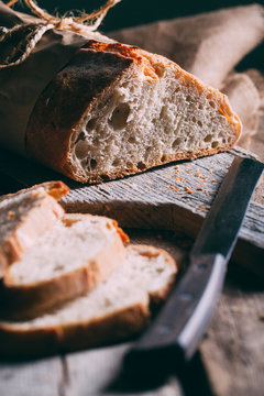 Rustic bread loaf on dark background