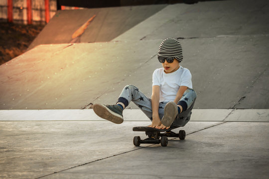 Little Boy Enjoy Skateboarding