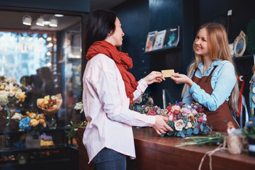 Young girl buying a bouquet of flowers