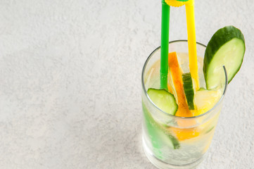 summer cooling drink with lemon and cucumber in a glass