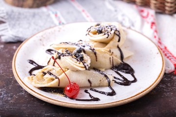Pancakes with chocolate sauce. Sweet dessert