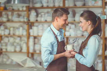 Smiling couple in pottery