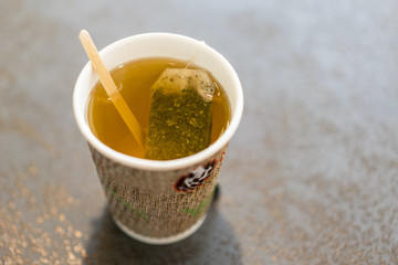 tea in a corton cup. tea bag