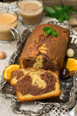 Chocolate and orange marble cake served with coffee