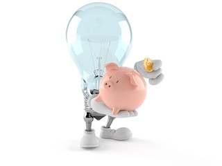 Light bulb character holding piggy bank