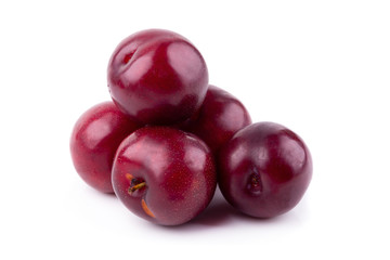 Red cherry plum isolated on white background