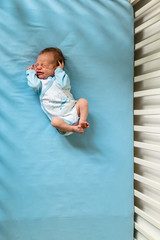 baby in crib © cherryandbees