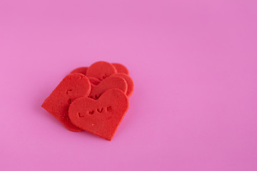 Red heart shaped sugar on pink background