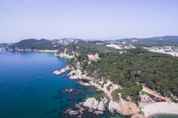 Naklejka na ściany i meble Aerial view of the rocks in the sea on a sunny day in the Costa Brava in Spain