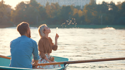Young couple in a boat - Powered by Adobe