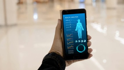 4K Hands of woman using using smartphone with HUD head up display user interface for mobile application technology concept
