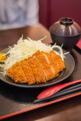 Deep fried pork cutlet (tonkatsu) in japanese restaurant