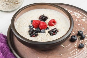 Delicious morning breakfast. Muesli with milk and berries.