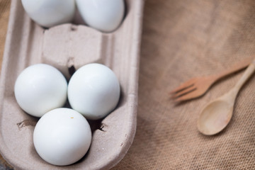White eggs in open carton container