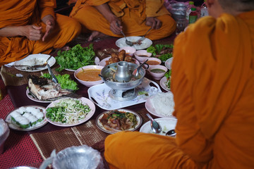 Buddhist monks take lunch