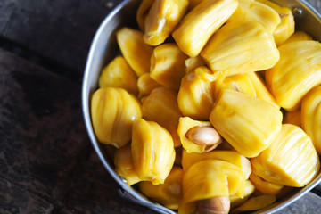 Fresh jackfruit slices on plate.