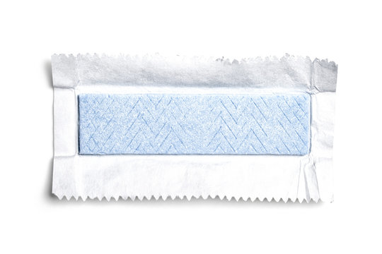 Top view of unwrapped chewing gum on white background