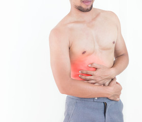 Naklejka premium Young man feeling unwell with a stomach ache on white background.