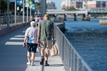 Elderly Couple Walking Outdoors
