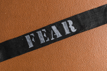 Title fear on the leather background - 203943682