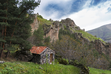 Fototapeta na wymiar Hut under the Stone. Georgia, May.2017