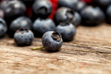 Blueberries on wooden board background. Healthy eating