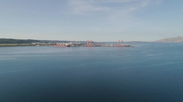 Sea cargo port with cranes, docks, containers in Subic Bay. Philippines,Luzon. Aerial view: cargo port and container terminal.