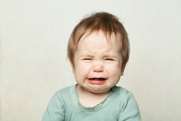Naklejka premium Baby crying, portrait. Small child 6, months old