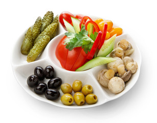 Plate of cold appetizers isolated on white background