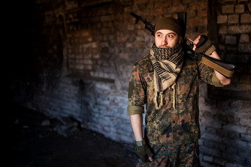 The Arab soldier with the AK-47 Kalashnikov assault rifle