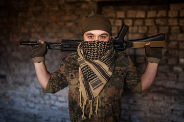 The Arab soldier with the AK-47 Kalashnikov assault rifle