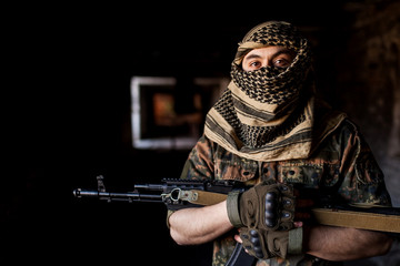 The Arab soldier with the AK-47 Kalashnikov assault rifle