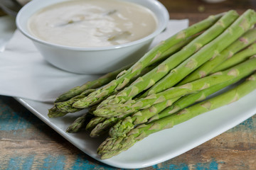 Seasonal fresh homemade asparagus soup made from white and green asparagus vegetables