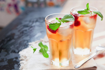 Refreshing summer drink with raspberry, mint and ice copy space