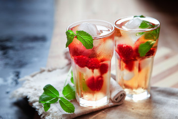 Refreshing summer drink with raspberry, mint and ice copy space - obrazy, fototapety, plakaty