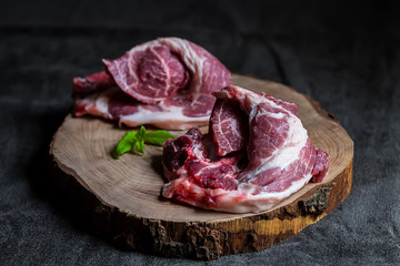 two pieces of pork isolated wooden board