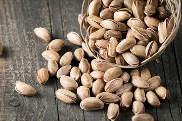 Healthy mix nuts on wooden background. Almonds, hazelnuts, cashews, peanuts, pistachios, brazilian nuts