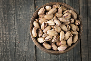 Healthy mix nuts on wooden background. Almonds, hazelnuts, cashews, peanuts, pistachios, brazilian nuts