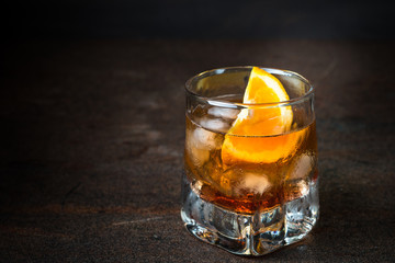 Negroni cocktail in glass on dark. 