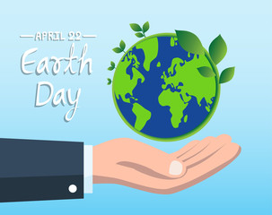 Earth Day concept with hand holding blue globe