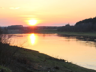 spring river in the evening at sunset