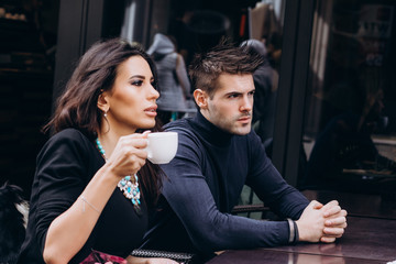 Fashion engagement shooting, photo session for beautiful couple, walk of a couple in love around the city and park.