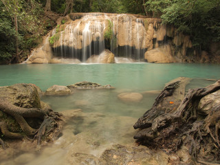 Fototapeta na wymiar Beautiful and breathtaking green waterfall, Erawan Waterfall at Kanchanaburi, Thailand