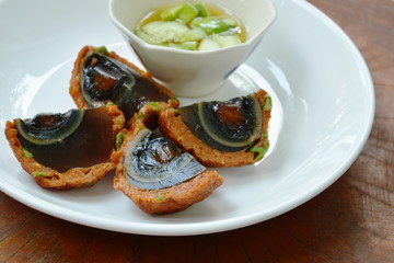 fried preserved egg wrapped fish cake dipping sweet sauce