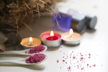  spa concept . pink bath salt with candle on the white background.