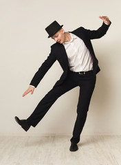 Portrait of young businessman playing marionette