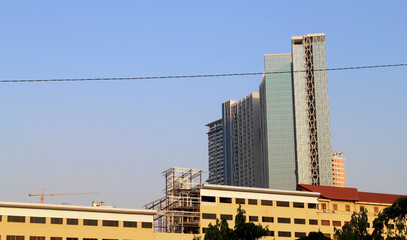 Skyscrapers and one typical black cable in downtown of Phnom Penh, the capital of Cambodia, Asia. Asian architectural background.