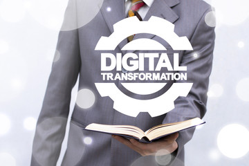 Digital Transformation Education Business Technology. Digitilization. Digitization Learning concept. Man offers book with gear and digital transformation words.