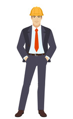 Businesswoman in construction helmet standing with hands in pockets