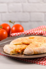 Pizza calzone on wooden background